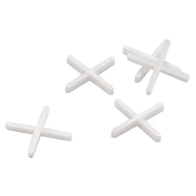 5 white cross like tile spacers, scattered on a transparent background
